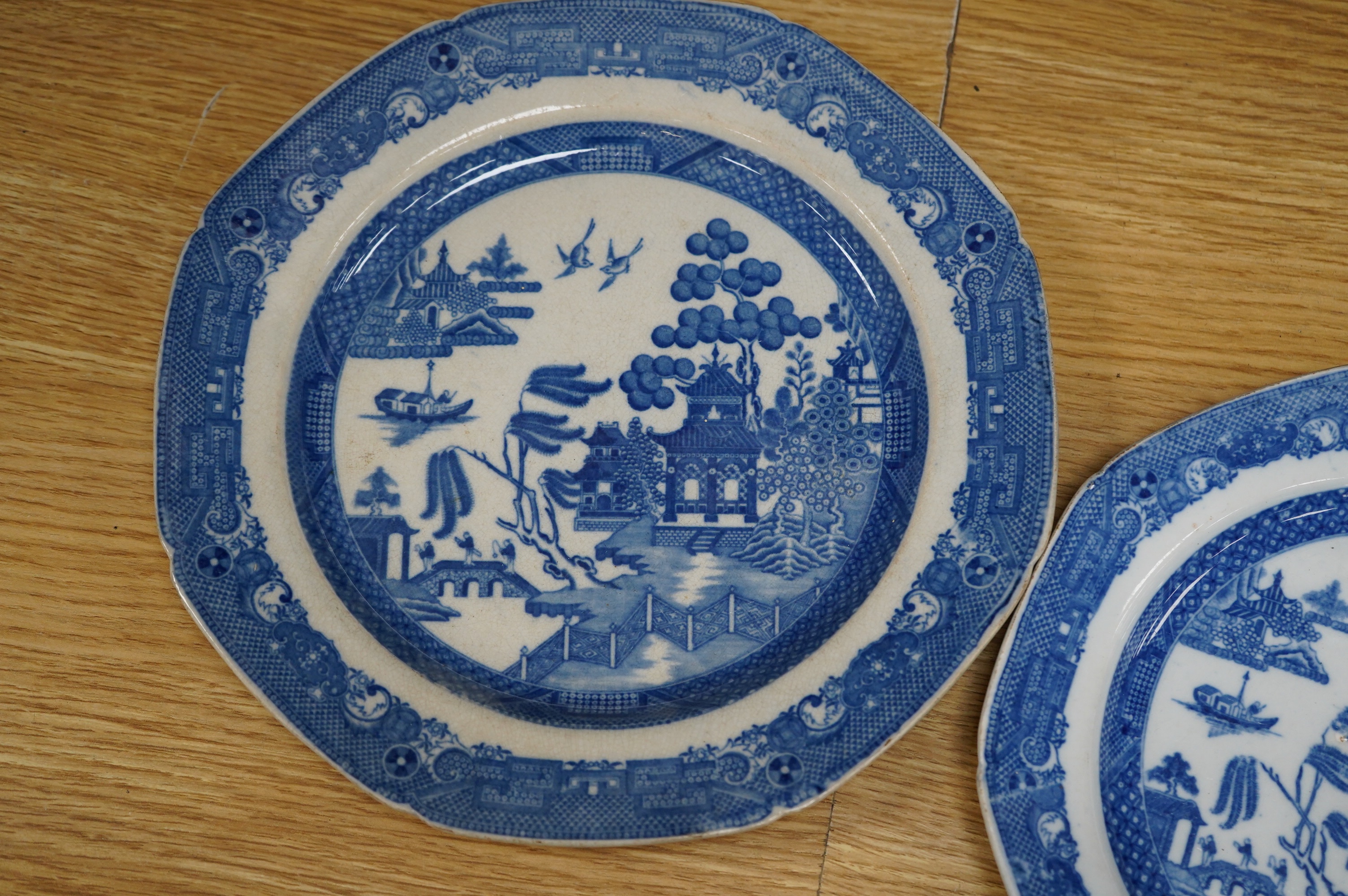 Four early 19th century English pearlware blue and white plates, largest 23.5cm. Condition - fair